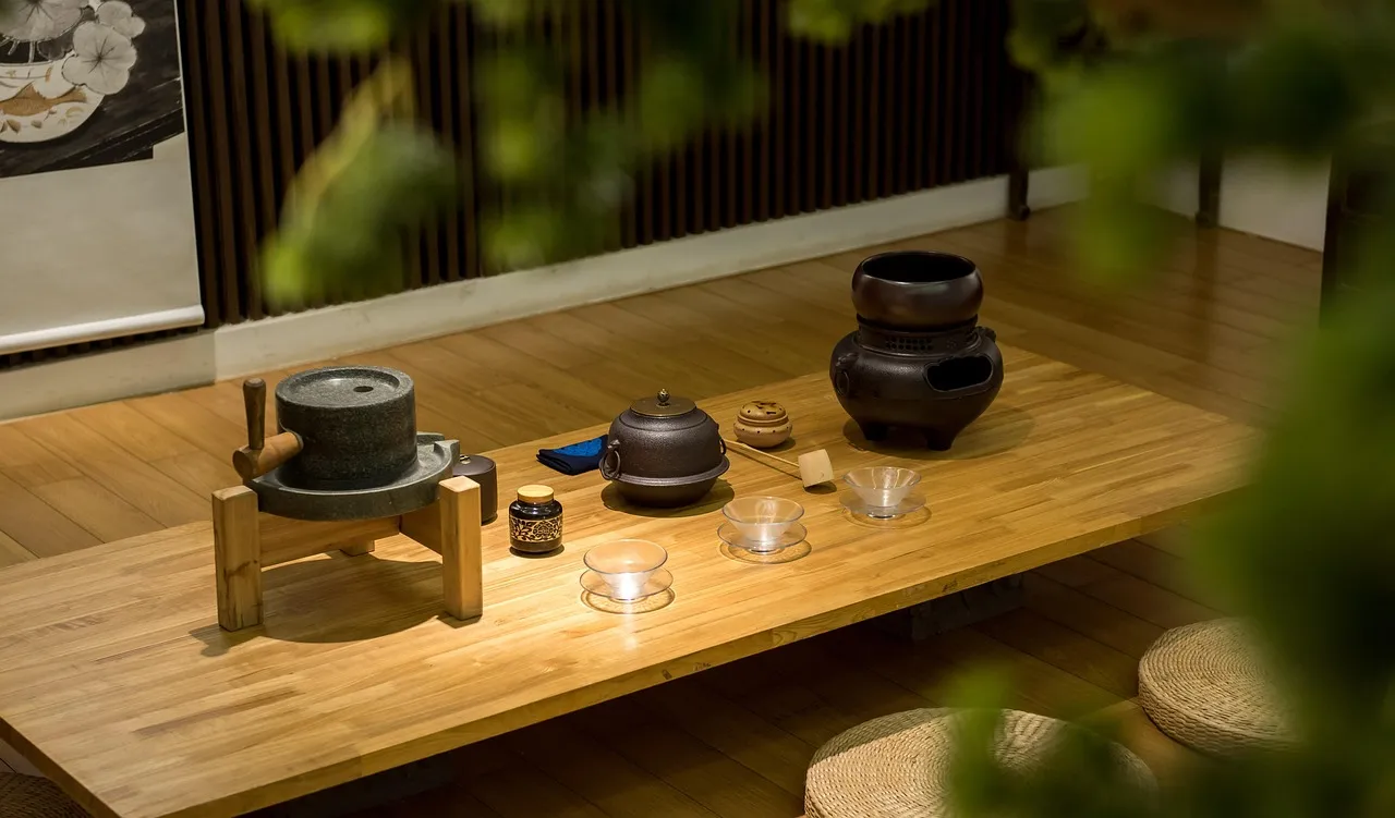 Chinese tea utensils laid out on a low wooden table